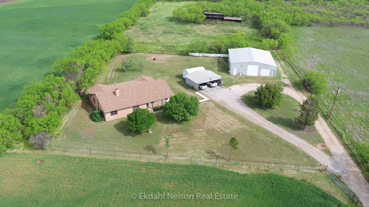 Ariel shot of home and farm - Real Estate Agency Callahan County