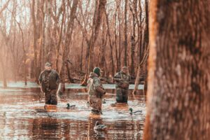 men hunting together on hunting land