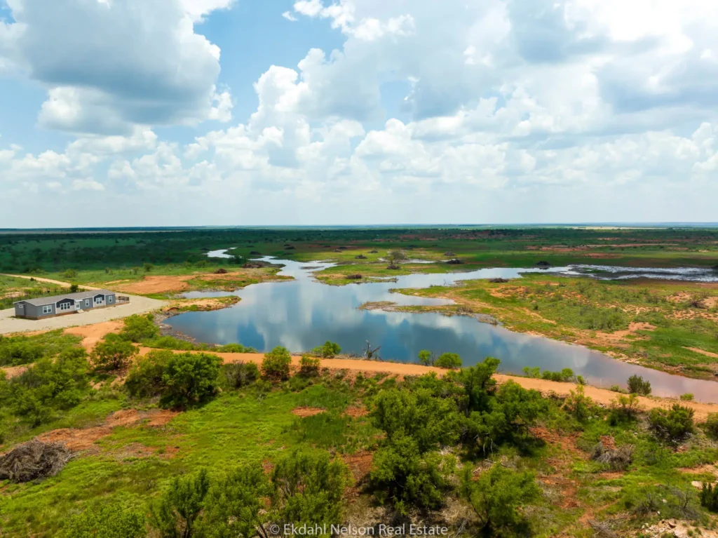 Image of ranch land with water to convey how to increase the value of your land