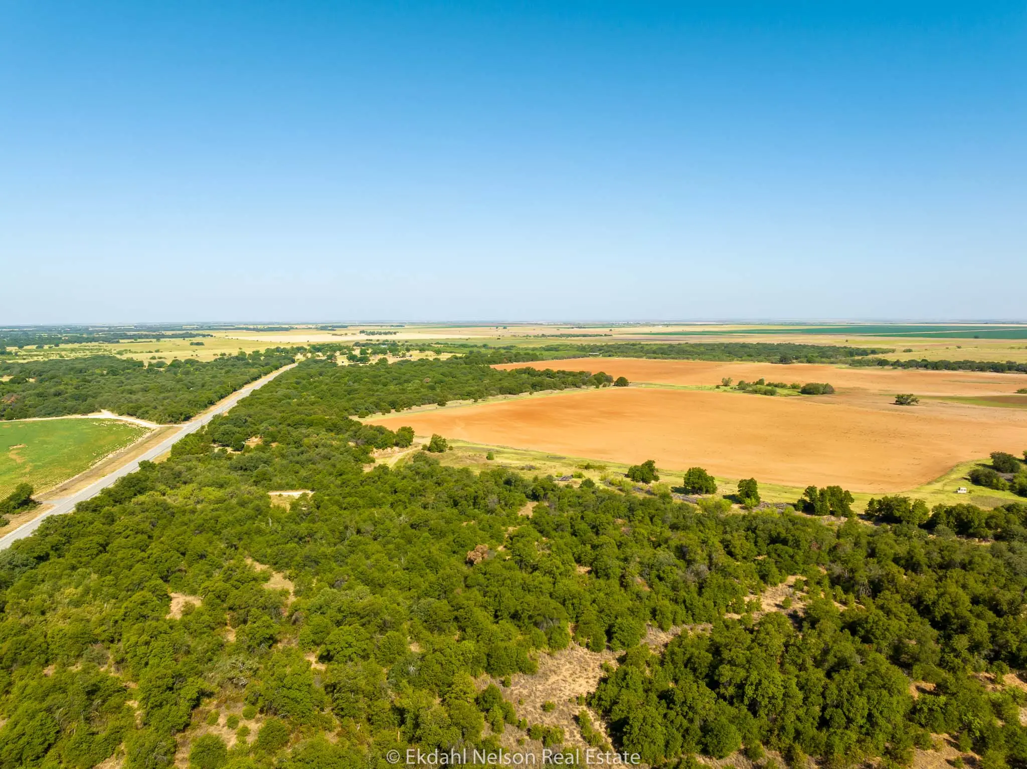 Aerial image of field and acres to convey the best dove hunting land for sale
